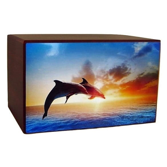 Dolphins jumping in the beautiful sunset wood urn